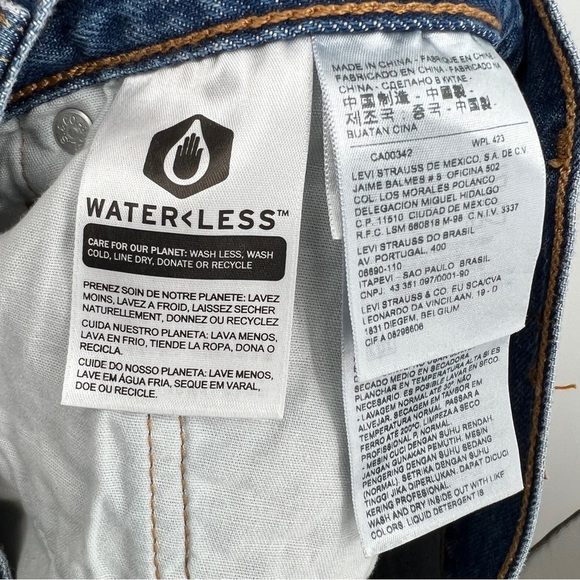 Levi's 501 medium wash button placket frayed raw edge whiskered denim shorts. - Picture 12 of 13